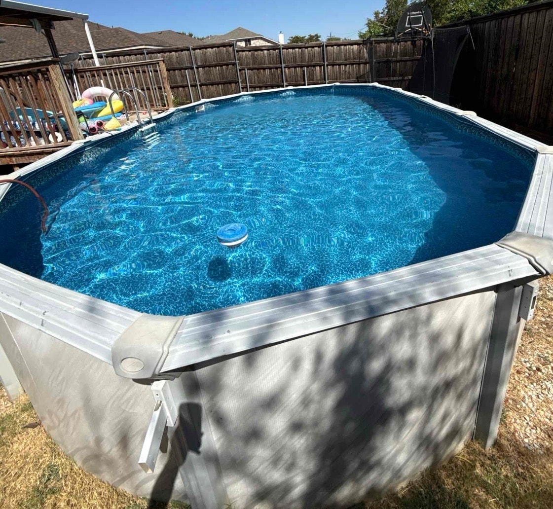 Above ground pool in backyard
