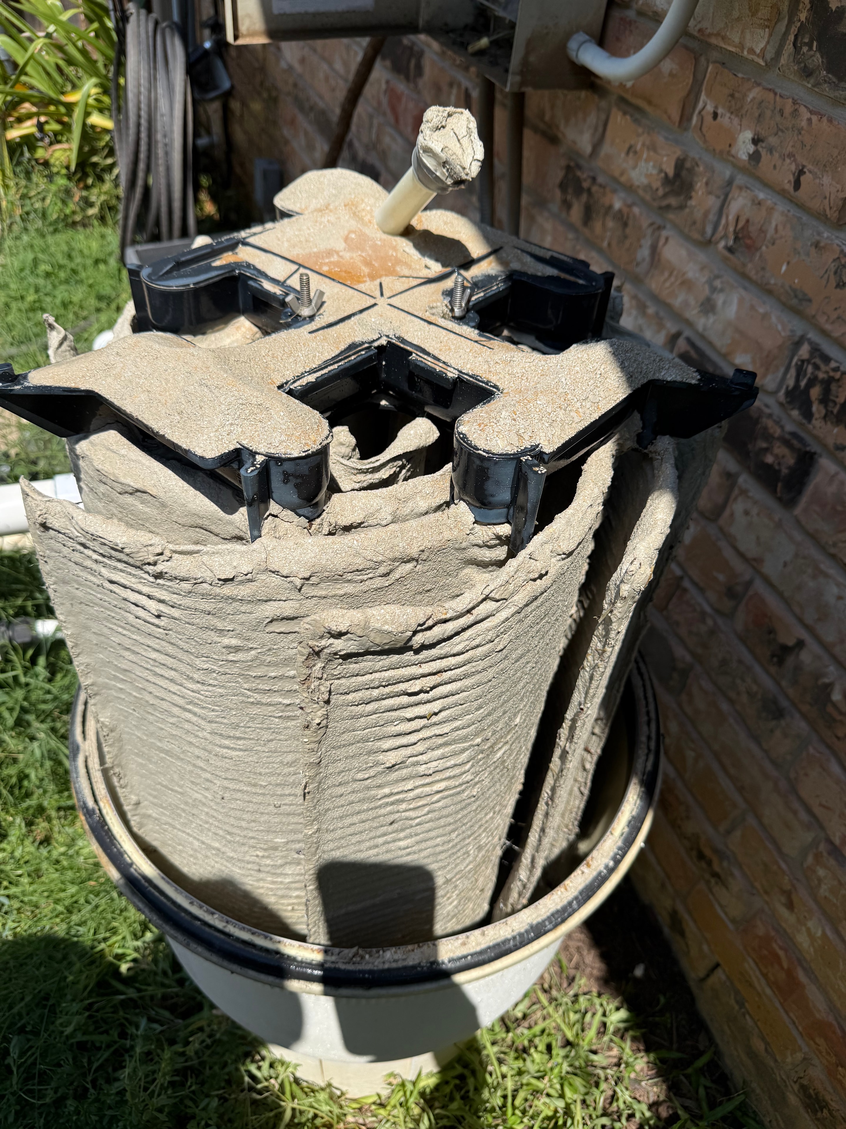 Filter before cleaning — caked with debris