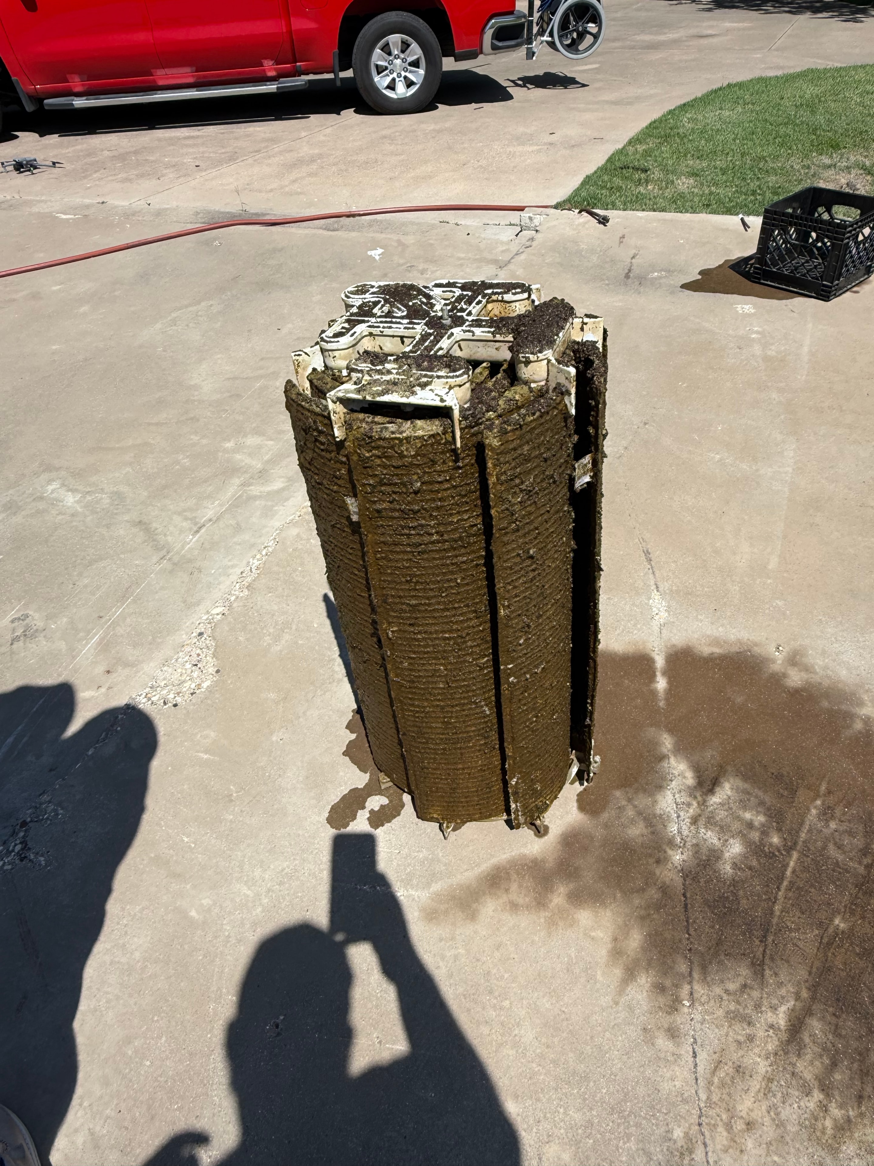 Heavily soiled pool filter on concrete